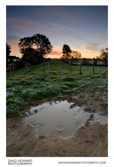 Sunrise and puddle on the old railway line