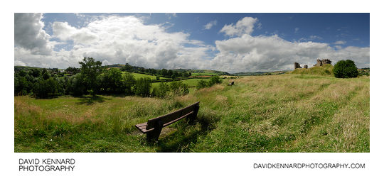 Bench and grass by Clun Castle