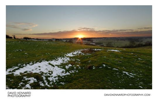 Snowy dip on East Farndon hill at sunset