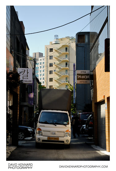 Van driving down Gyeonjidong-gil