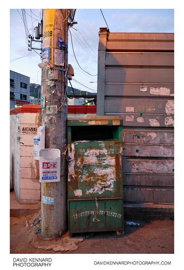 Stickered bin and pole