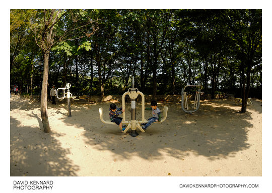 Children playing on exercise equipment on Namsan (남산), Seoul, South Korea