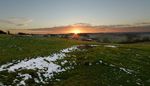 Snowy dip on East Farndon hill at sunset