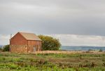 Ironstone and red brick farm building