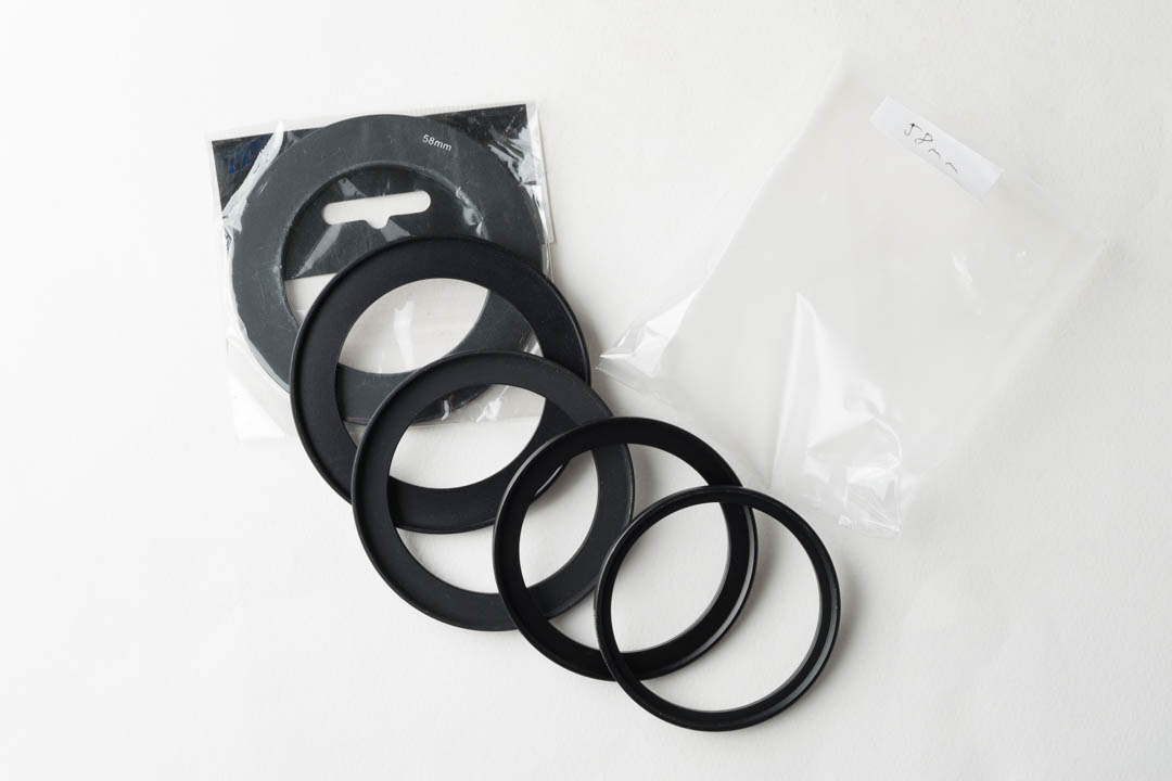 58mm step-up ring packet with stepping rings removed and spread out to show the contents