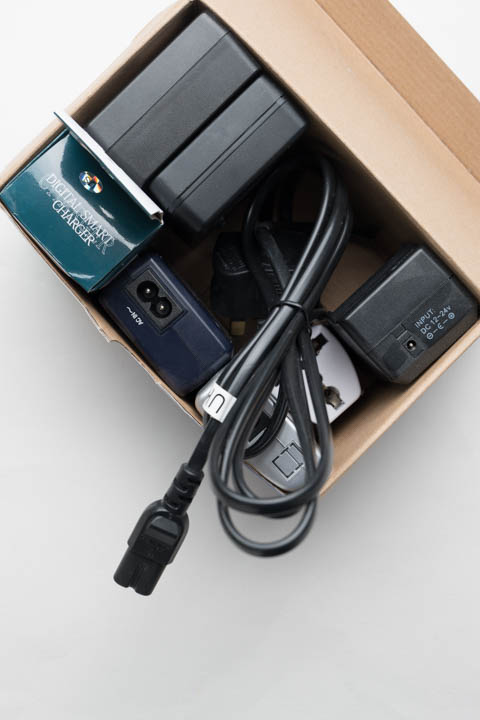 Box of battery chargers with figure 8 (IEC C7) power cable