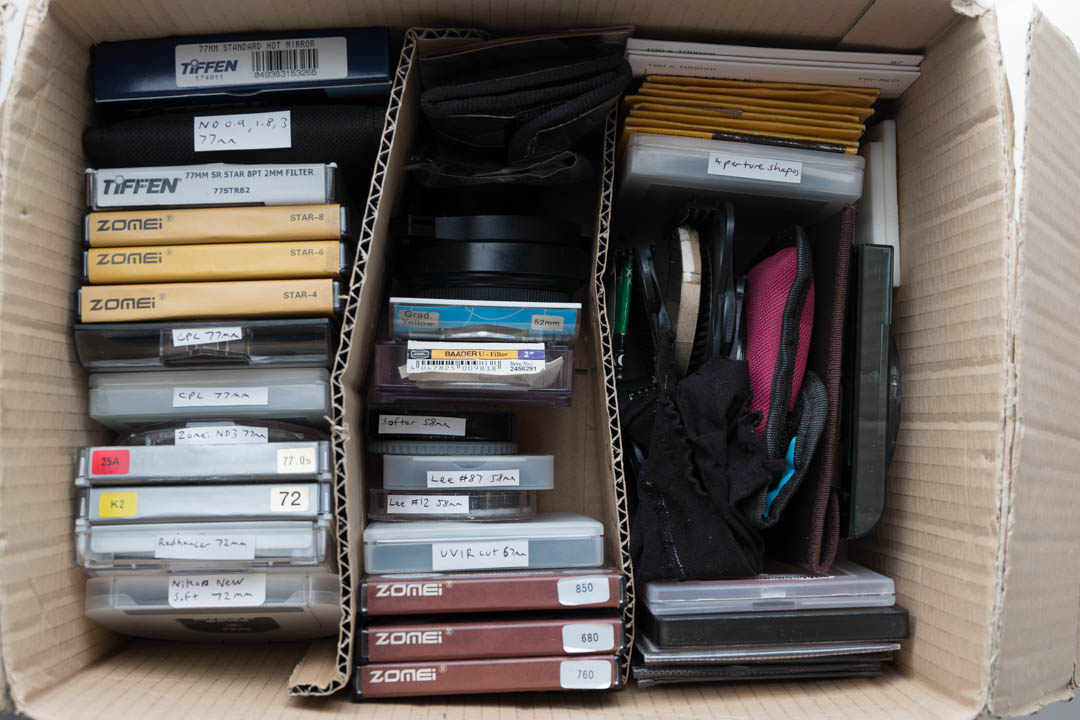 Box of filters arranged by type (screw-in, gelatine / acrylic, and cokin P)