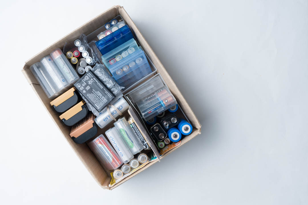 box of batteries organised into groups based on size and set size (batteries used together as a single set)