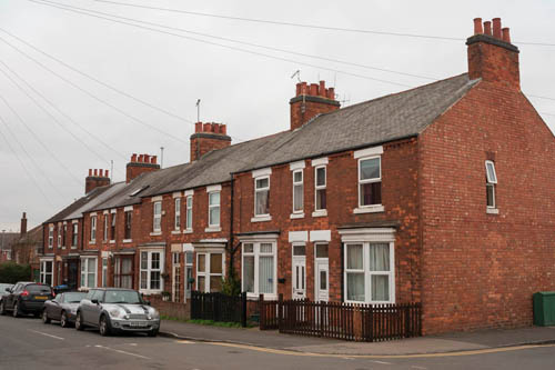 Image of a row of houses on an overcast day taken with standard Fuji X-A1 with Fuji 27mm lens.