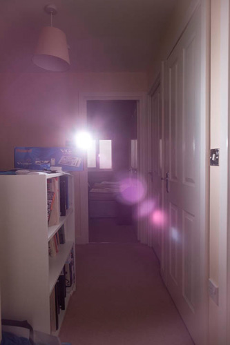 Image of a flash pointed at camera to create lens flare, taken with Fuji 14mm on full spectrum Fuji X-M1 and with Tiffen T1 filter on the lens.