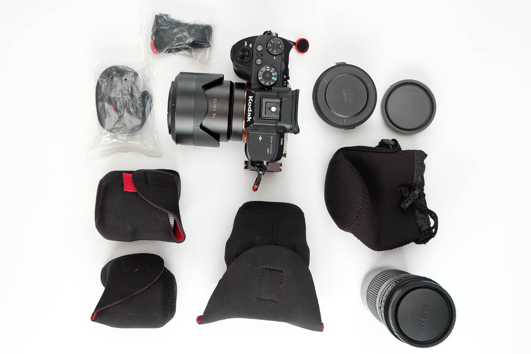 Camera, straps, lenses, and adapter