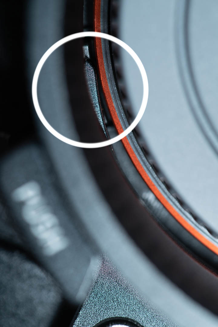 Area between the inside of the rotator ring and the lens mount, showing how little clearance there is between the ring's lens release button mechanism and the camera mount.