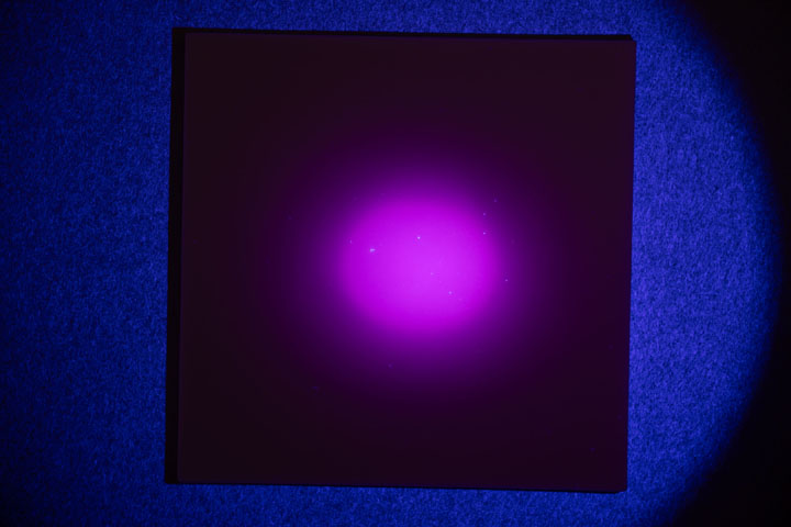 Visible light photo of PTFE on card, lit by AloneFire SV108 flashlight