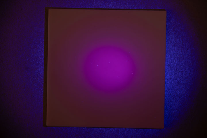 Visible light photo of PTFE on card, lit by AloneFire SV62 365nm flashlight