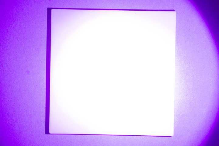 Visible light photo of PTFE on card, lit by UltraFire WF-501B flashlight