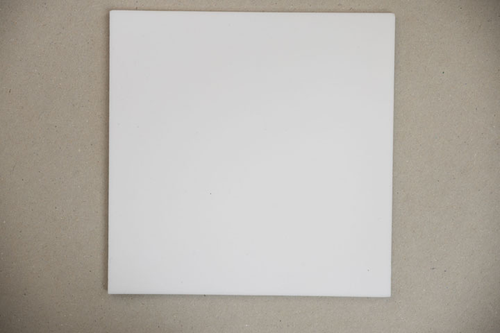 Square of PTFE on grey card background