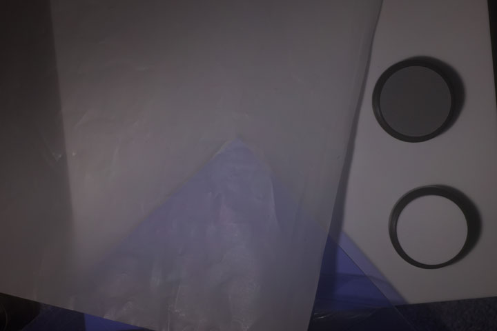0.1mm thick PTFE sheet over 2mm thick clear Perspex backing
