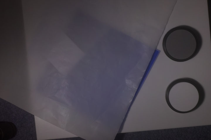 0.1mm thick PTFE sheet over 2mm thick clear acrylic backing