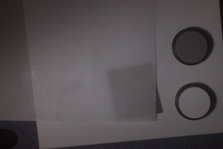 0.25mm thick PTFE sheet over piece of brown cardboard backing