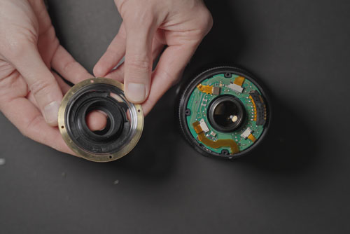 EF-S mount removed from 10-22mm lens, with the black plastic inner ring and metal mount ring separated