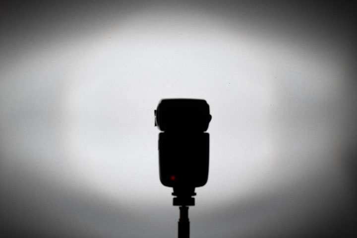 Photo showing light spread / distribution from full spectrum modified Godox V860II with Fresnel and front lens, 1/64 power