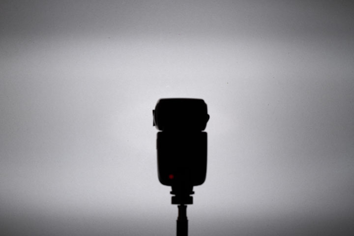 Photo showing light spread / distribution from full spectrum modified Godox V860II with front lens, 1/64 power