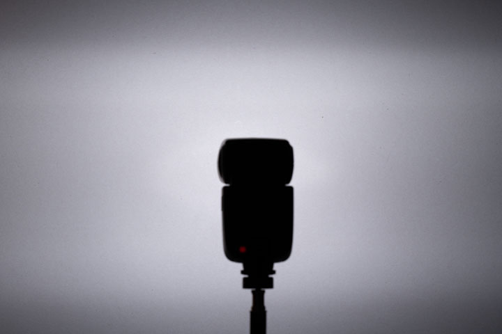 Photo showing light spread / distribution from full spectrum modified Godox V860II (no Fresnel), 1/64 power
