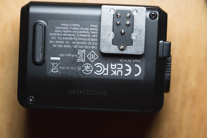 Bottom of the Godox it30 Pro flash with screw holes visible