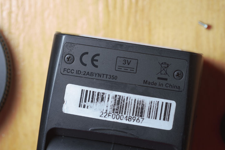 Godox TT350 flash head showing screws normally hidden under sticker
