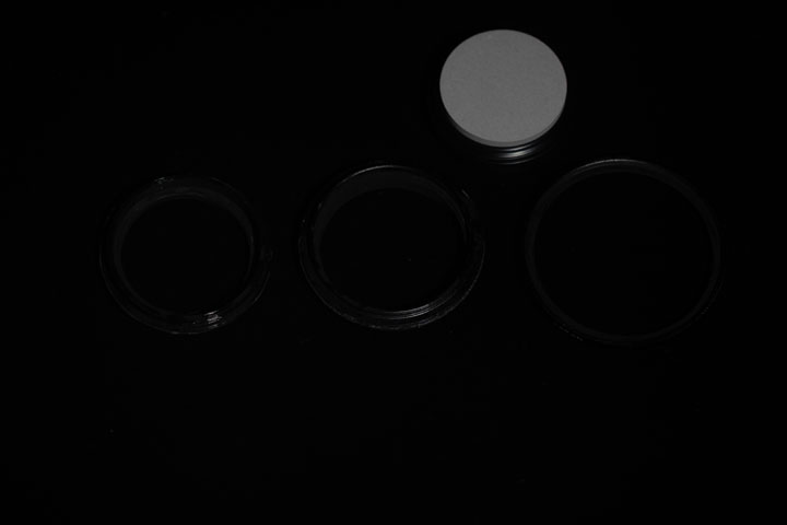 Photo of filter rings after painting with Black 2.0 paint, shot in visible light
