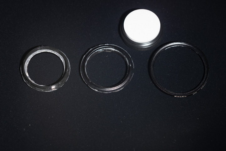 Photo of filter rings before painting with Black 2.0 paint, shot in visible light