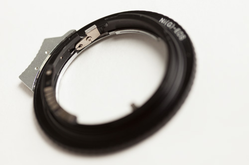 Lens release switch on the Nikon G AF-S AI F Lens to Canon EOS EF Mount Adapter