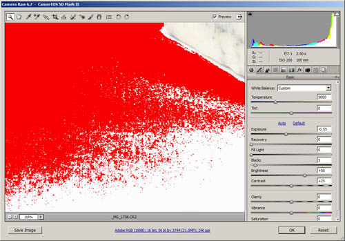Image in ACR with highlight clipping warning turned on, showing clipped areas as bright red