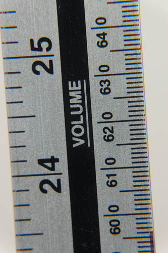 Photo of a ruler taken with Fuji X-A1 and 16-50mm kit lens at 50mm and minimum focus distance and Sonia +4, +2, and +1 close-up filters attached