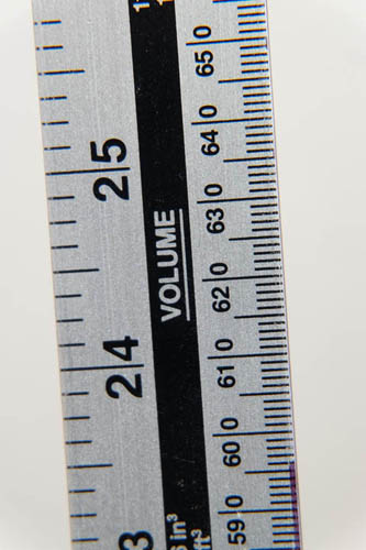 Photo of a ruler taken with Fuji X-A1 and 16-50mm kit lens at 50mm and minimum focus distance and Sonia +4 close-up filter attached