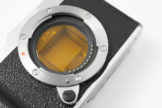 Fuji X-M1 camera with deep yellow internal filter attached